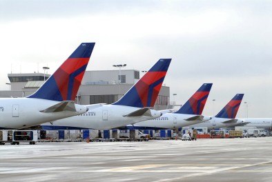 2 charged with stealing $22 million from Delta